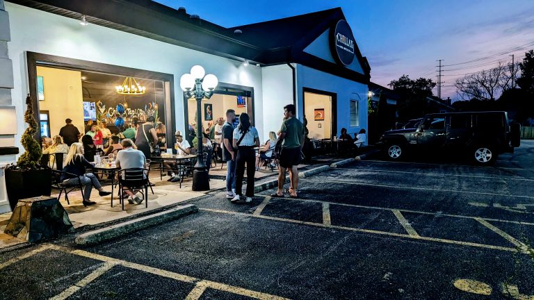 Pet-friendly outdoor patio and open garage seating area at Chillax Tap & Co.